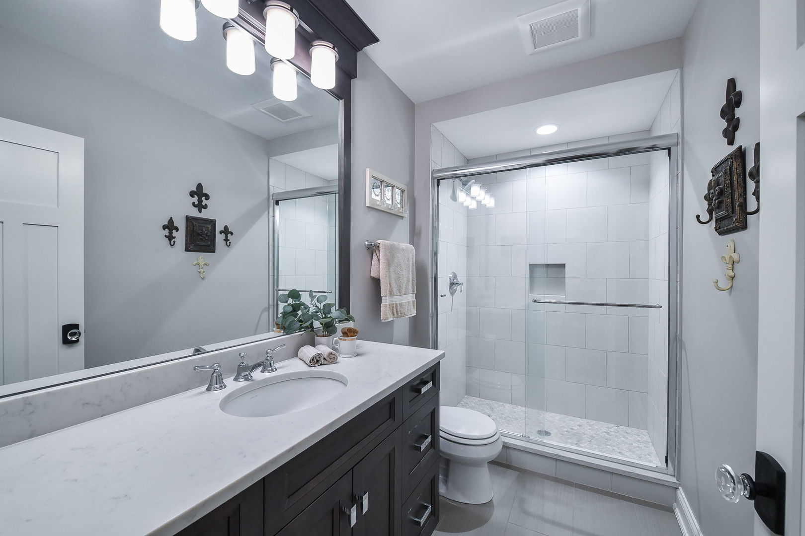 39-w914 Kellar Square Geneva, IL 60134 - Photo 51 of 68 a bathroom with a sink a toilet and shower