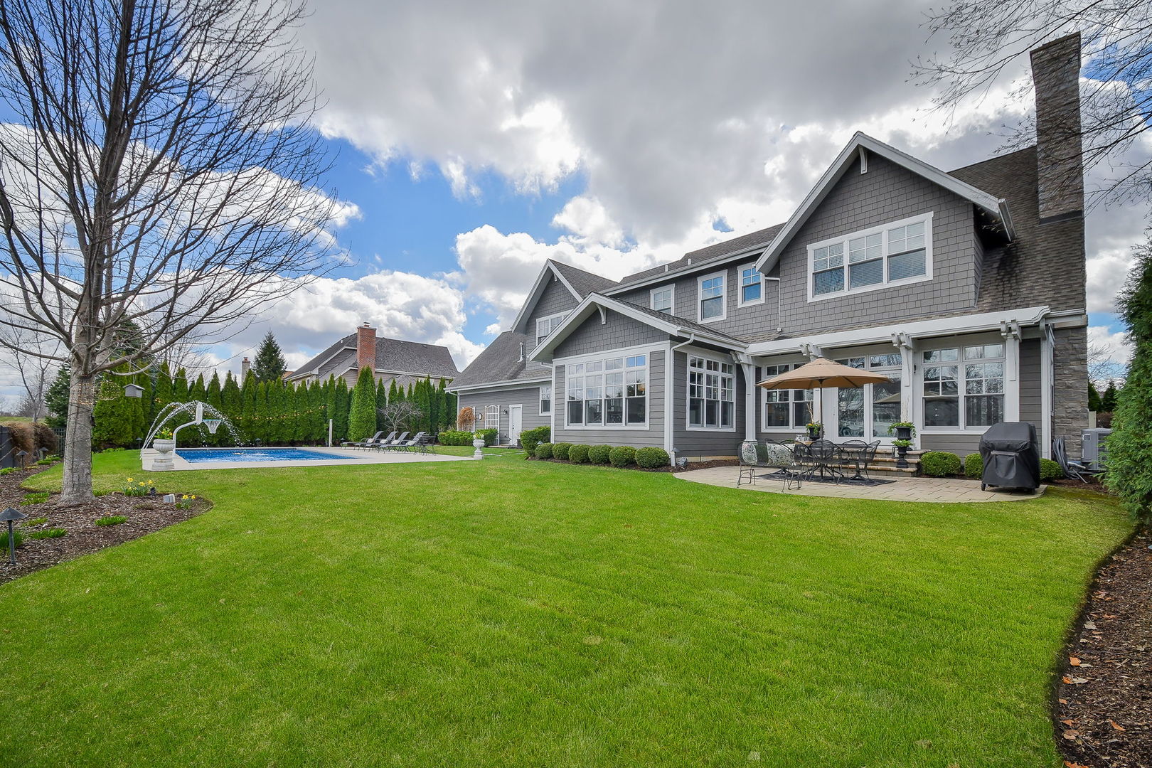 39-w914 Kellar Square Geneva, IL 60134 - Photo 58 of 68 a front view of a house with swimming pool having outdoor seating