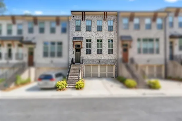 a view of a brick building with many windows
