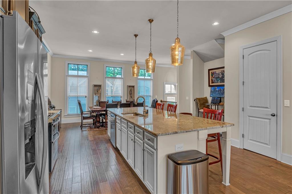 2453 Soft Maple Street Doraville, GA 30360 - Photo 13 of 30 a kitchen with sink cabinets and wooden floor