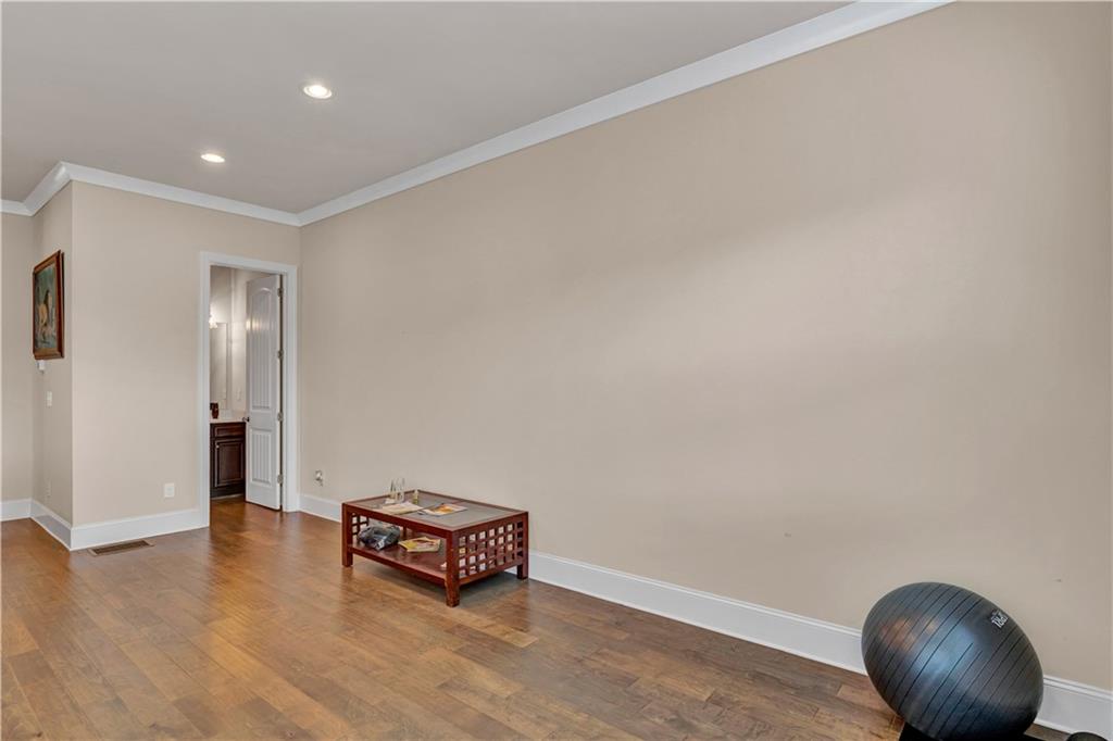 2453 Soft Maple Street Doraville, GA 30360 - Photo 15 of 30 an empty room with wooden floor and windows