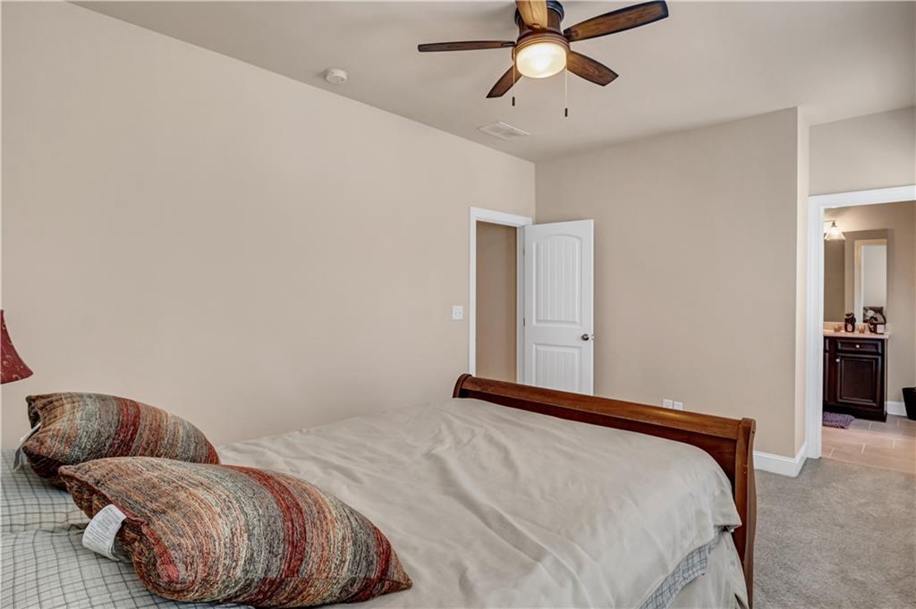 2453 Soft Maple Street Doraville, GA 30360 - Photo 19 of 30 a bedroom with a bed and ceiling fan