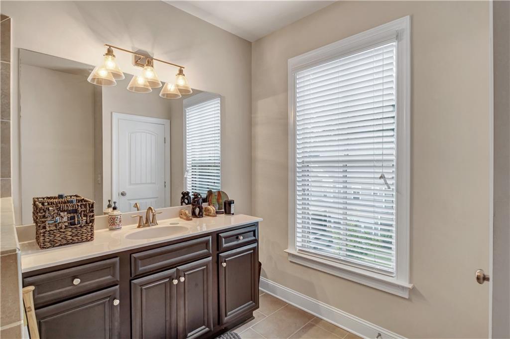 2453 Soft Maple Street Doraville, GA 30360 - Photo 20 of 30 a bathroom with a double vanity sink and a mirror