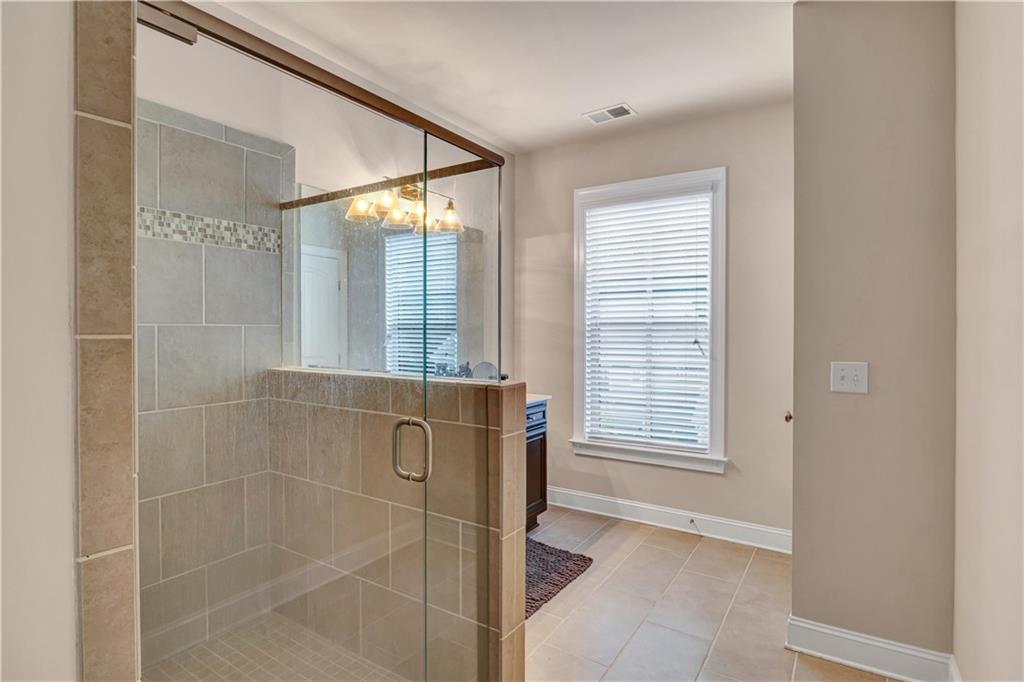 2453 Soft Maple Street Doraville, GA 30360 - Photo 21 of 30 a bathroom with a shower and a sink