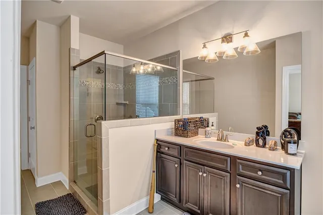 a bathroom with a sink vanity and a mirror