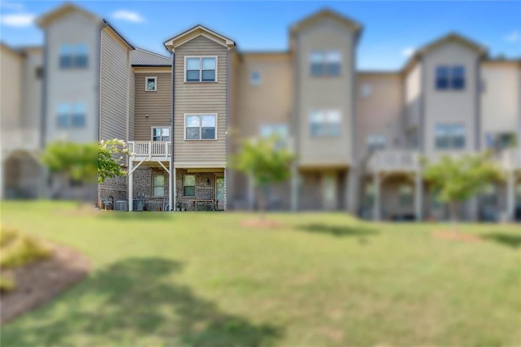 2453 Soft Maple Street Doraville, GA 30360 - Photo 3 of 30 a view of a big room with potted plants and large windows