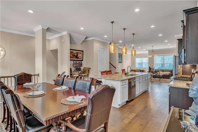 a large kitchen with a table and chairs
