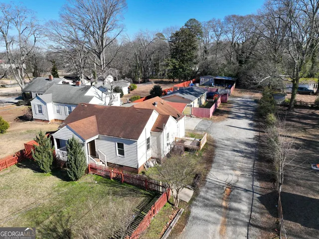 a view of multiple houses with yard