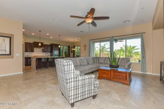 a view of livingroom with hardwood floor and a ceiling fan