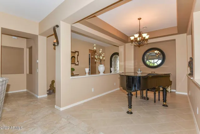 a lobby with furniture and a potted plant