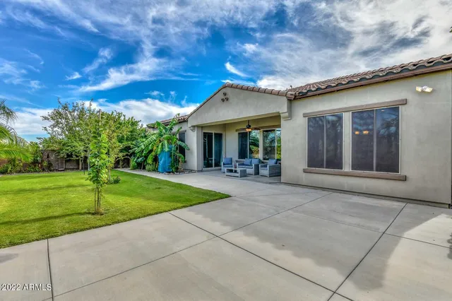 a view of a patio with a table and chairs