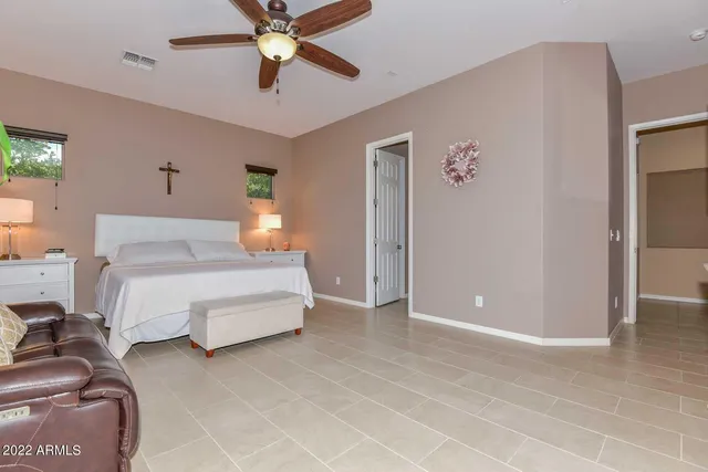 a bedroom with a bed and window