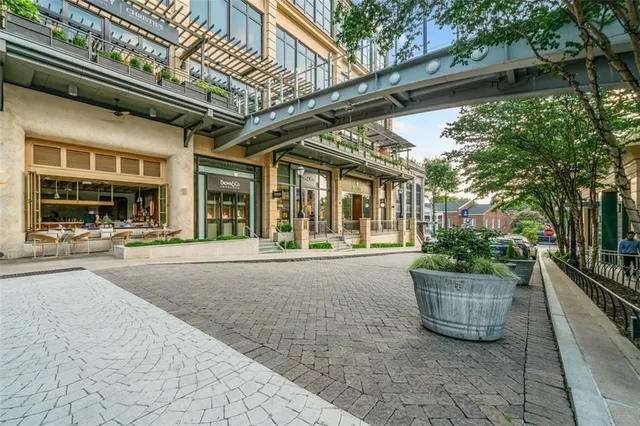 a view of a patio with chairs and plants
