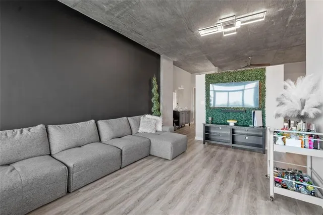 a living room with furniture and a large window