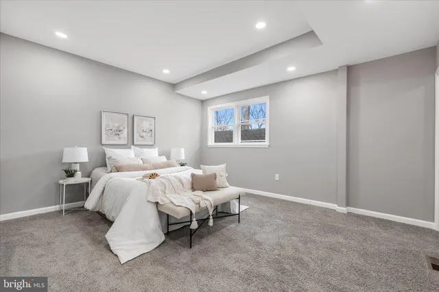 a bedroom with bed and a window