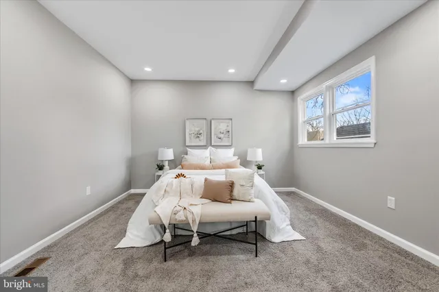 a bed room with a bed and furniture