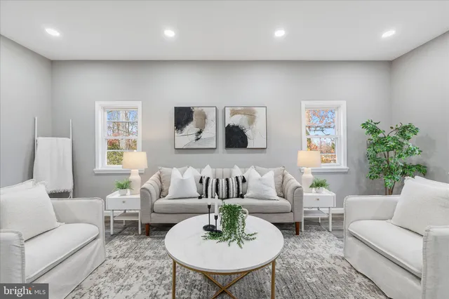 a living room with furniture and a table