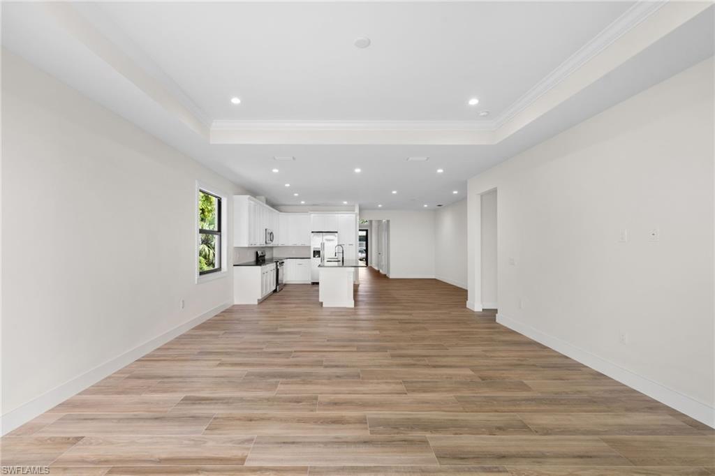 3049 Pine Tree Drive Naples, FL 34112 - Photo 27 of 38 a view of kitchen with wooden floor