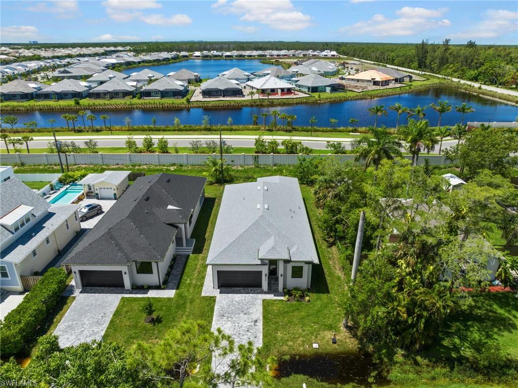 3049 Pine Tree Drive Naples, FL 34112 - Photo 28 of 38 an aerial view of residential houses with outdoor space and swimming pool