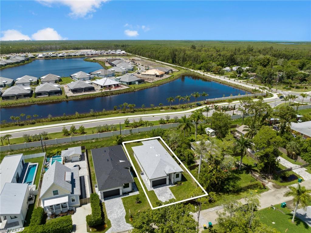 3049 Pine Tree Drive Naples, FL 34112 - Photo 34 of 38 an aerial view of a house with a ocean view