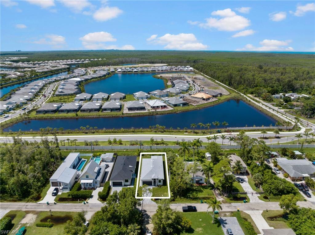 3049 Pine Tree Drive Naples, FL 34112 - Photo 36 of 38 an aerial view of a house with a ocean view