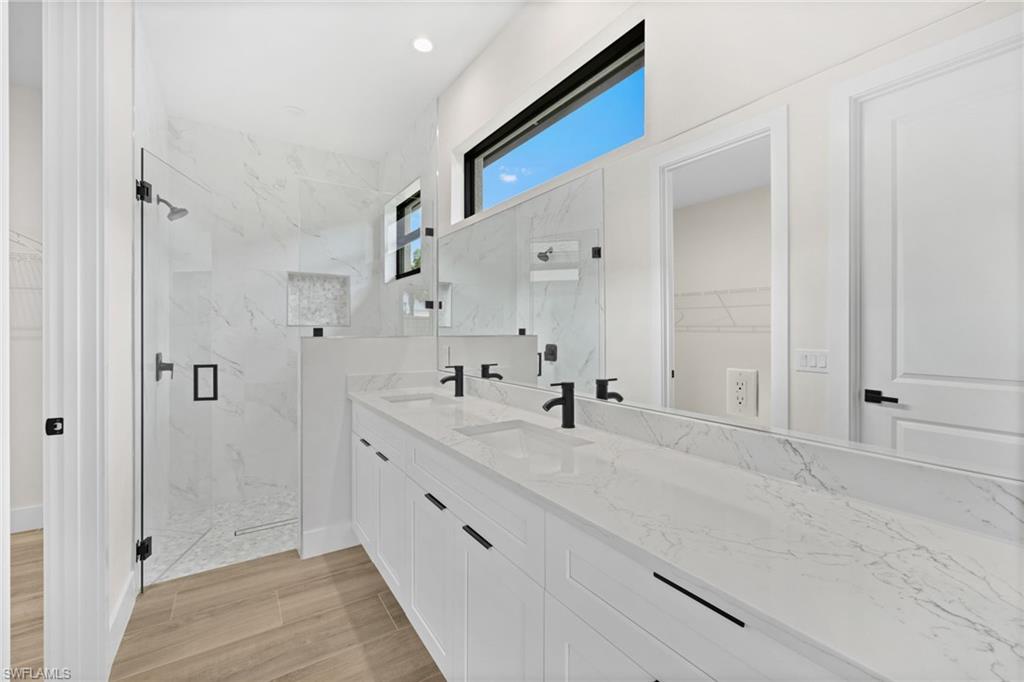 3049 Pine Tree Drive Naples, FL 34112 - Photo 4 of 38 a view of bathroom