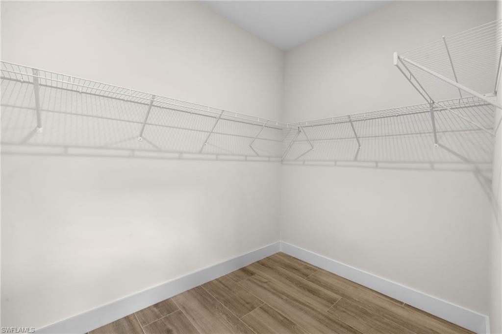 3049 Pine Tree Drive Naples, FL 34112 - Photo 8 of 38 a view of a small space with racks on the wall
