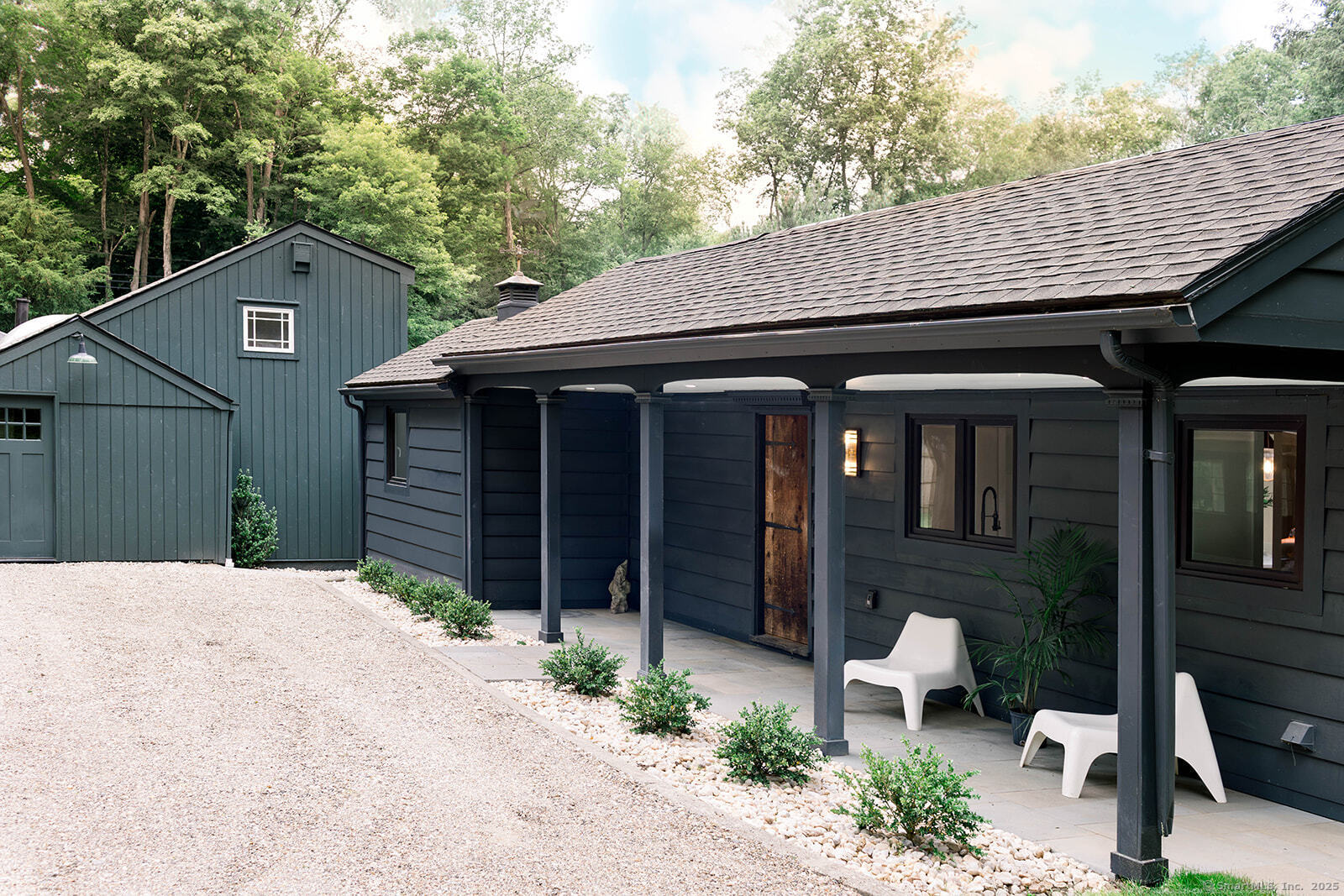 a front view of a house with garden