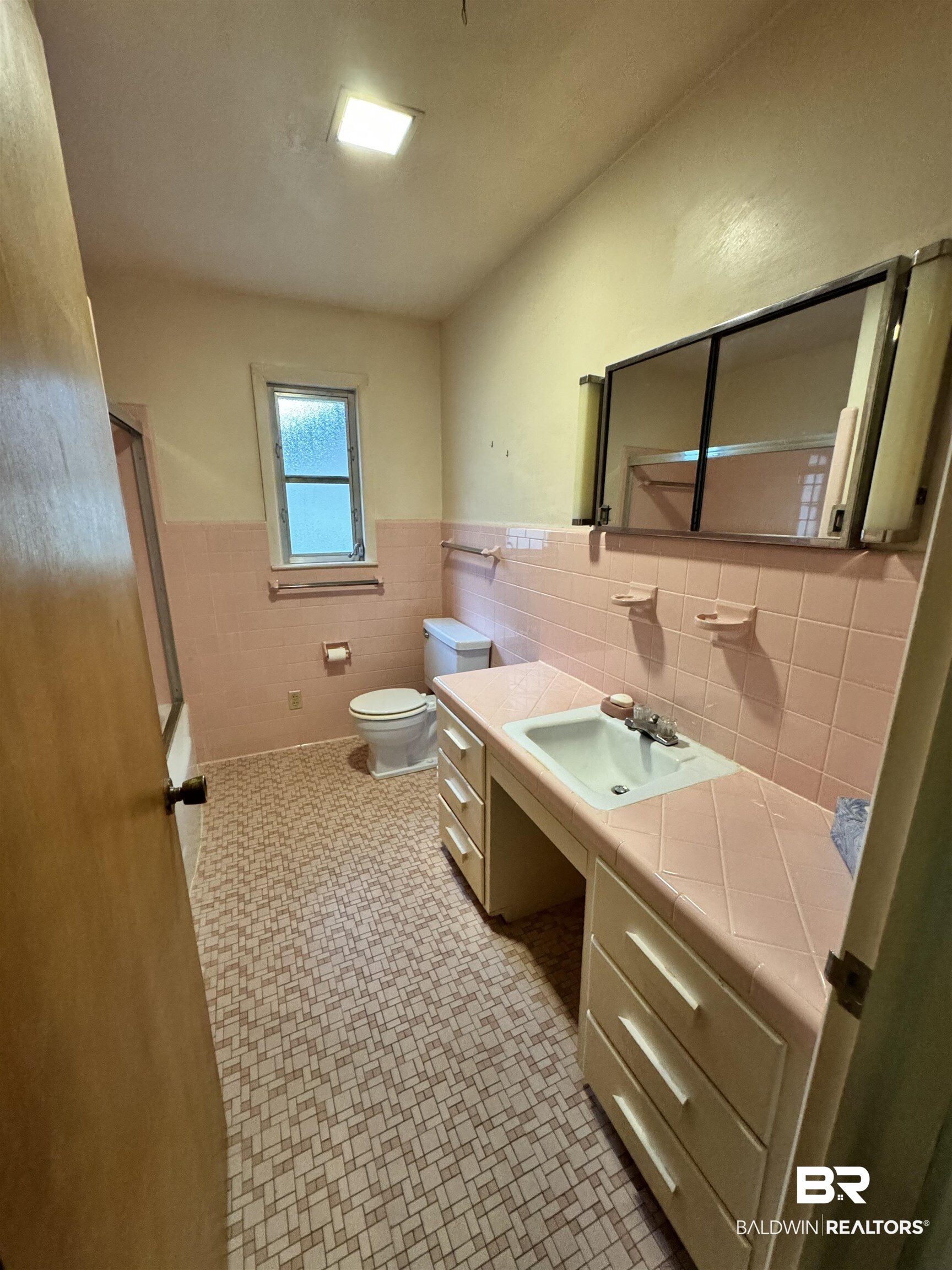 217 West Magnolia Avenue Foley, AL 36535 - Photo 15 of 21 Bathroom featuring vanity, toilet, and tile walls