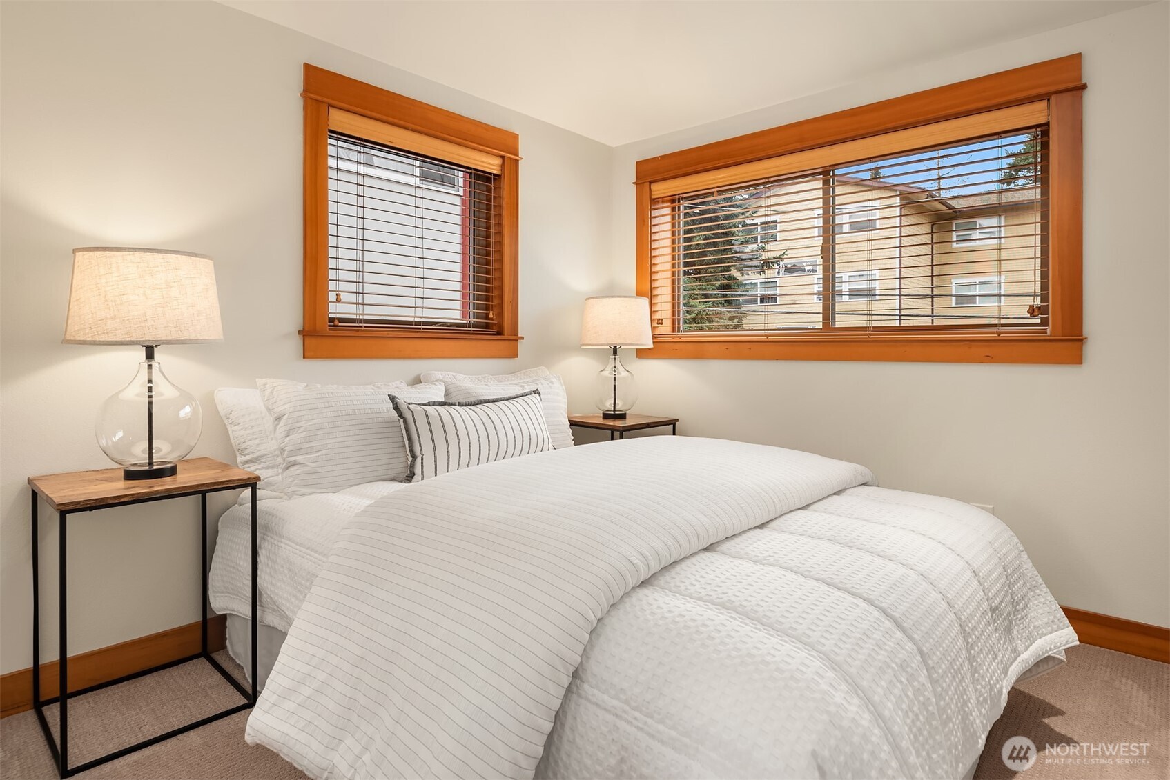 6537 34th Avenue Southwest Seattle, WA 98126 - Photo 12 of 22 a bedroom with a bed and a window
