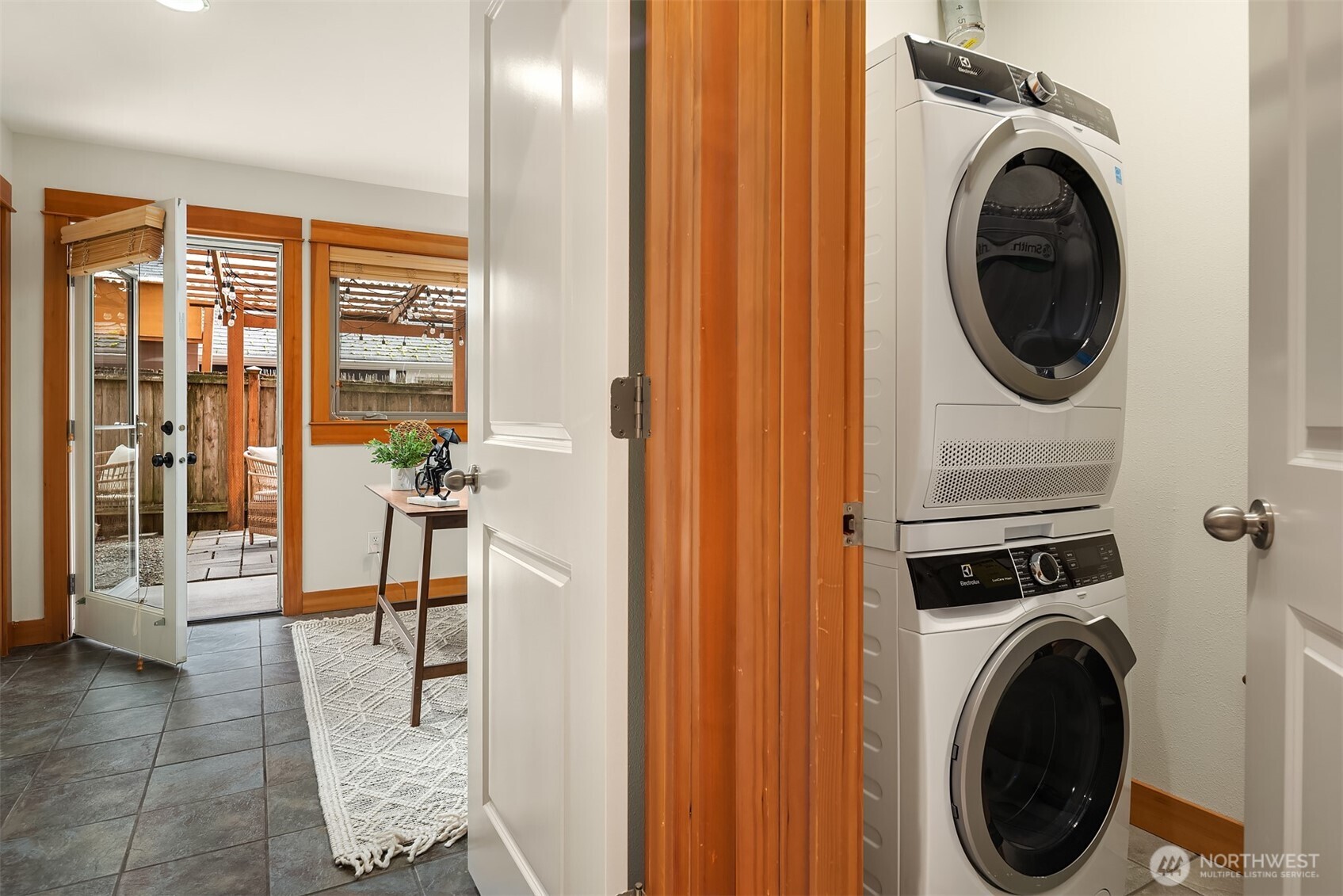 6537 34th Avenue Southwest Seattle, WA 98126 - Photo 18 of 22 a view of a hallway with washer and dryer