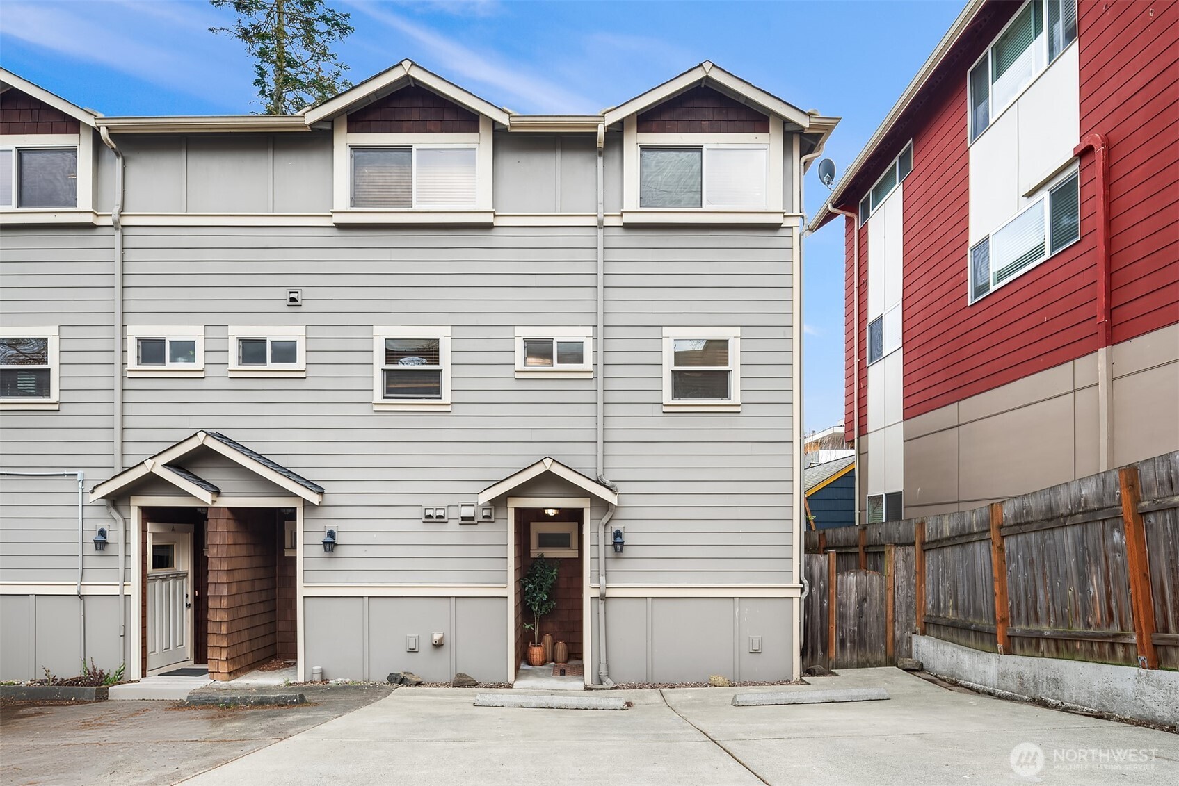 6537 34th Avenue Southwest Seattle, WA 98126 - Photo 21 of 22 a front view of a house with a yard