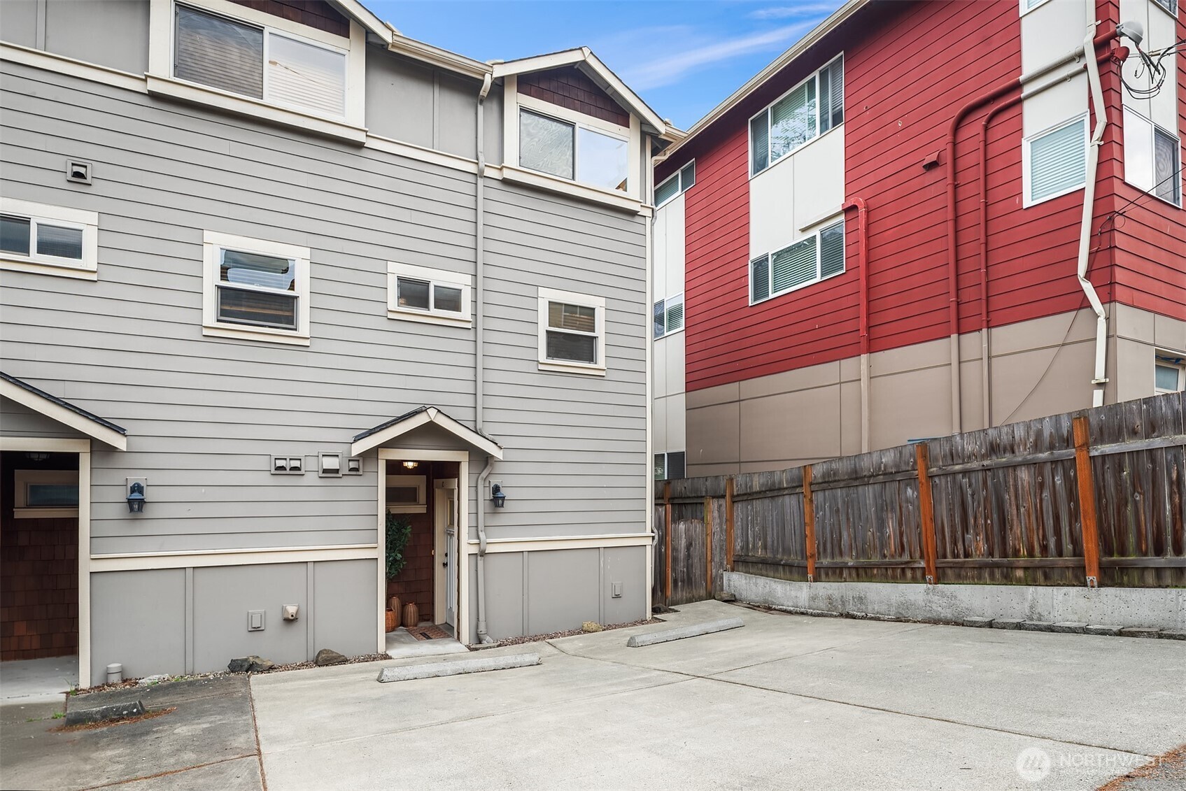 6537 34th Avenue Southwest Seattle, WA 98126 - Photo 22 of 22 a view of a house with a door and wooden fence