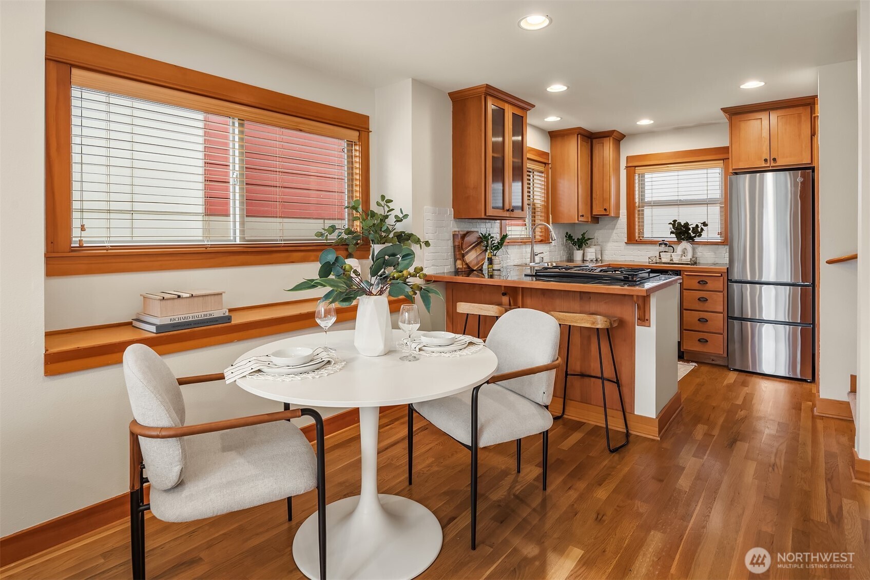 6537 34th Avenue Southwest Seattle, WA 98126 - Photo 3 of 22 a view of a dining room with furniture window and wooden floor