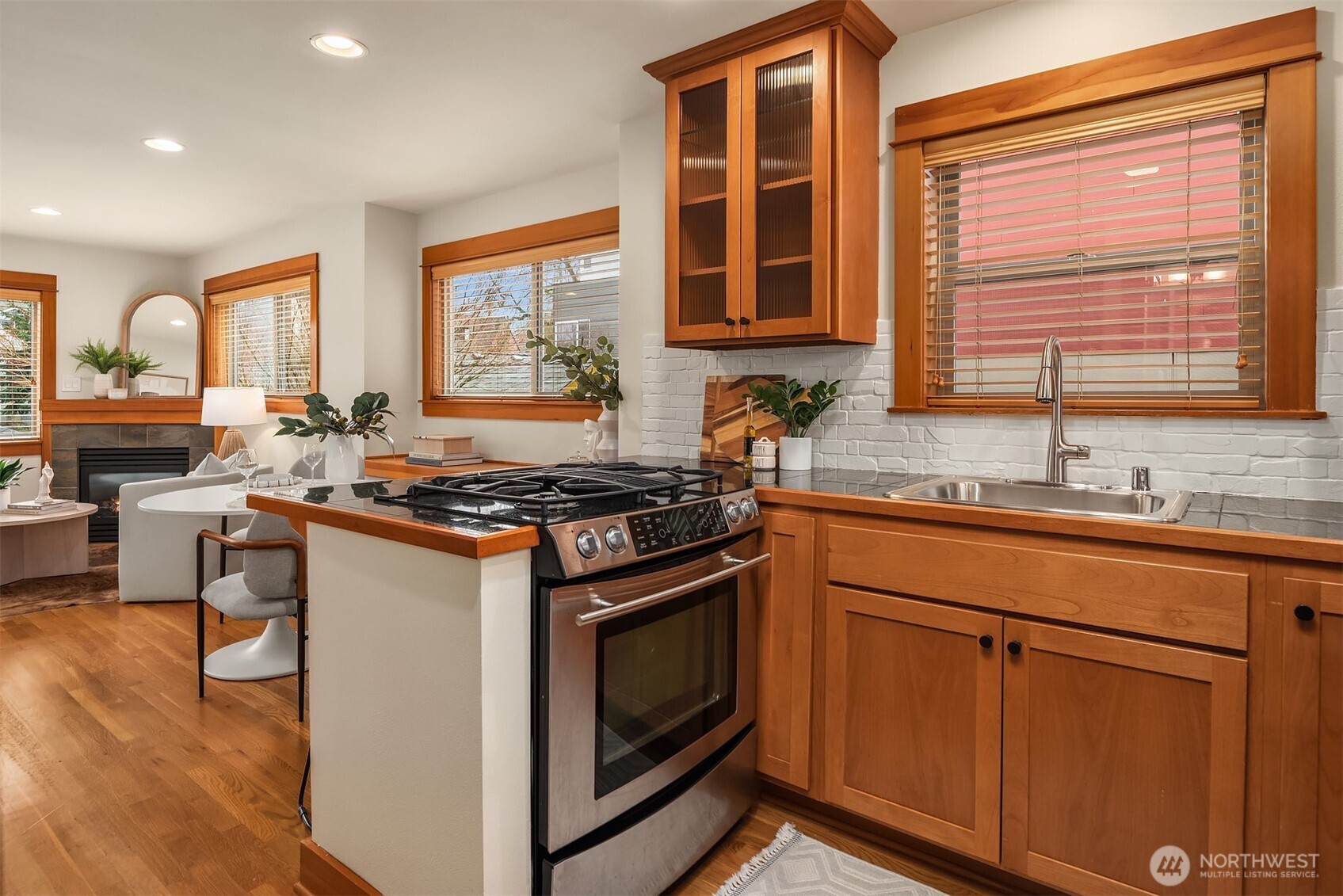 6537 34th Avenue Southwest Seattle, WA 98126 - Photo 9 of 22 a kitchen with stainless steel appliances granite countertop a stove and a sink