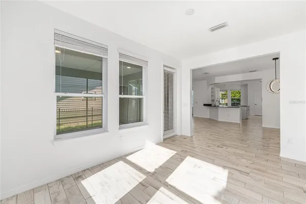 a view of an entryway with wooden floor