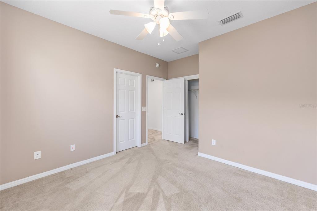 4970 Northwest 35th Ln Road Ocala, FL 34482 - Photo 24 of 41 a view of an empty room and chandelier fan