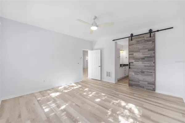 a view of an empty room with a cabinet