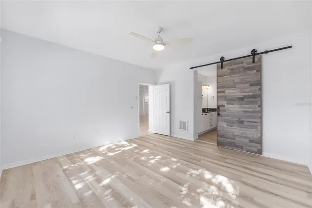 a view of an empty room with a cabinet