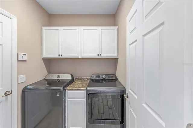 a utility room with dryer and washer