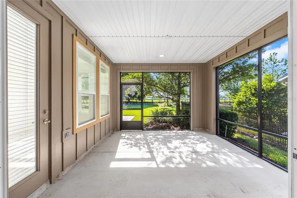 a view of a porch with wooden floor and outdoor space
