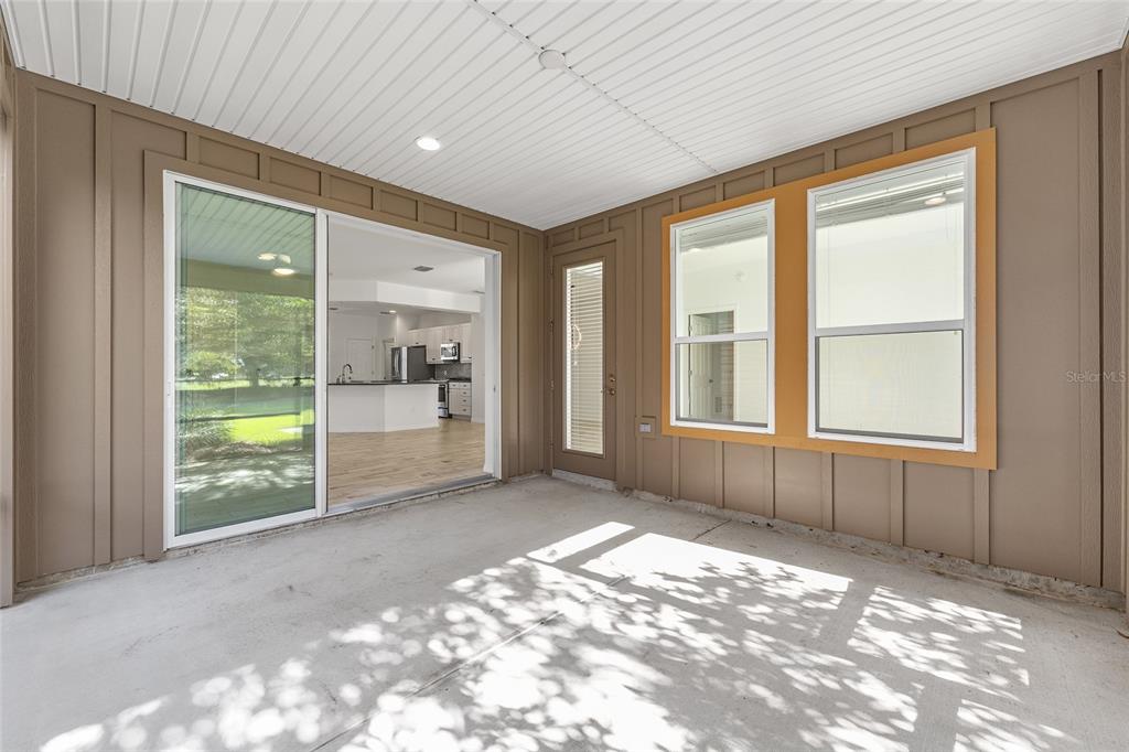 4970 Northwest 35th Ln Road Ocala, FL 34482 - Photo 36 of 41 a view of a big room with windows and entryway of the house