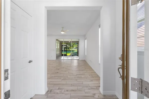 a view of an entryway with wooden floor and a window