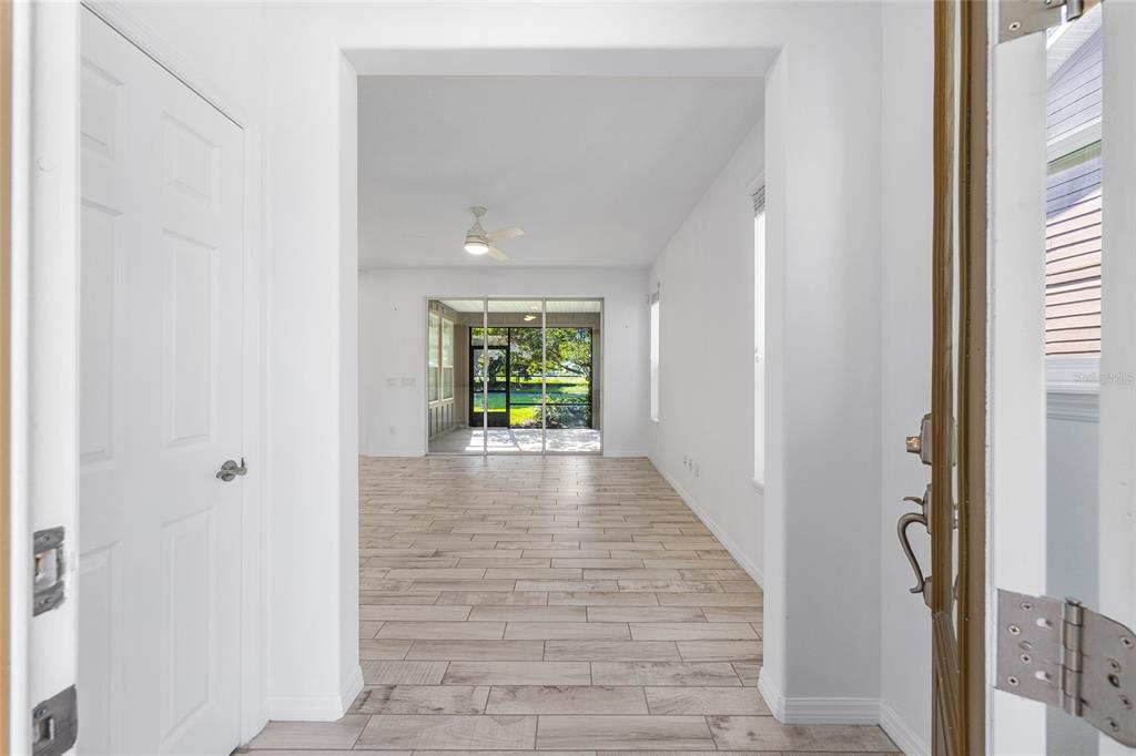 4970 Northwest 35th Ln Road Ocala, FL 34482 - Photo 5 of 41 a view of an entryway with wooden floor and a window