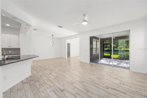 a view of a kitchen with a sink and a window