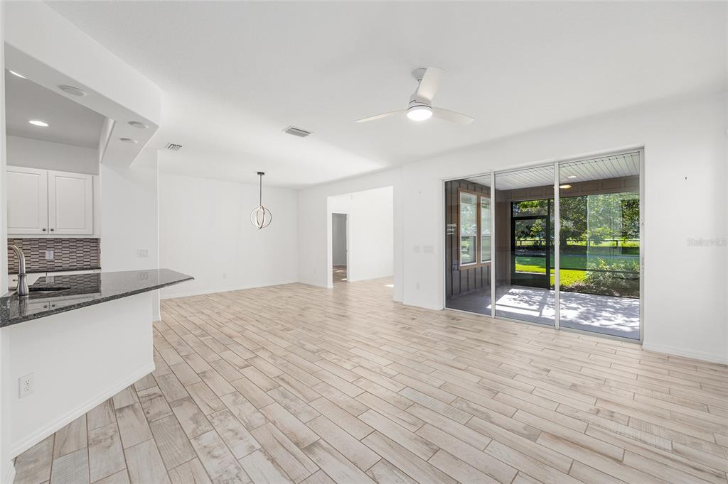 4970 Northwest 35th Ln Road Ocala, FL 34482 - Photo 7 of 41 a view of a kitchen with a sink and a window