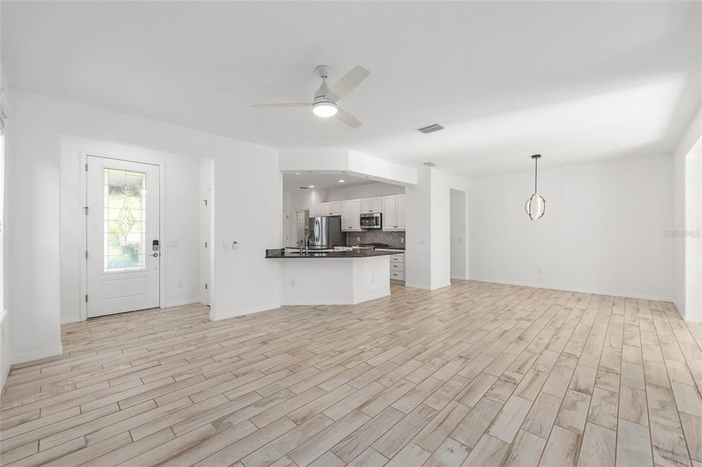 4970 Northwest 35th Ln Road Ocala, FL 34482 - Photo 8 of 41 a view of an empty room with kitchen and window