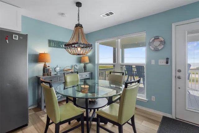 a bathroom with a sink vanity mirror and toilet