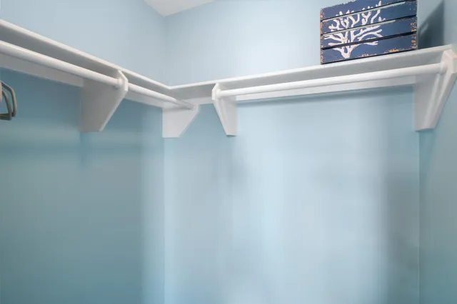 a work room with furniture and a window