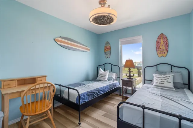a view of a patio with table and chairs and garden view